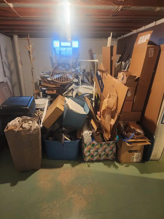 Roll-off dumpster container at job site for 2 Yard Dumpster Rental in Celina