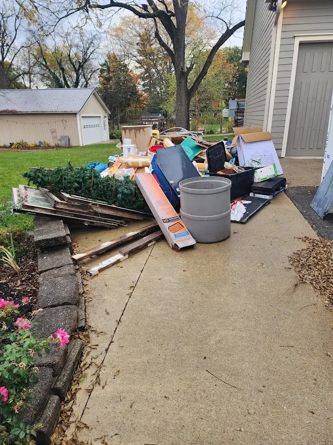 Dumpster being loaded with debris for Residential Dumpster Rental in Celina
